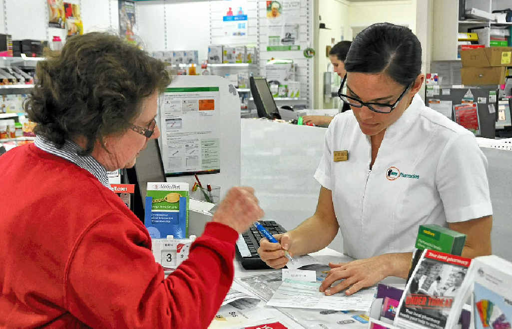Pharmacist and professional services manager Jaqueline Henricks helps a customer with a script. Pharmacist and professional services manager Jaqueline Henricks helps a customer with a script.